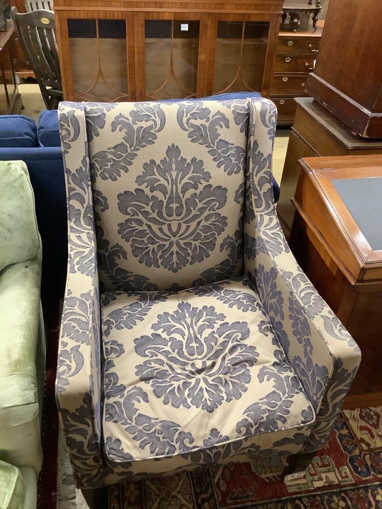 A contemporary armchair with silver/ blue patterned fabric, bought from the George Smith London store, width 74cm, depth 76cm, height 100cm